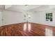 Spacious bedroom with hardwood floors, tray ceiling, and natural light at 2761 Valley Spring Dr, Lawrenceville, GA 30044