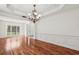 An elegant dining room boasts wood floors, large windows, and classic moldings at 2761 Valley Spring Dr, Lawrenceville, GA 30044