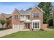 Charming two-story brick home featuring a well-manicured lawn and a two-car garage at 2761 Valley Spring Dr, Lawrenceville, GA 30044
