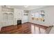Inviting living room with a fireplace, built-in shelves, and large windows at 2761 Valley Spring Dr, Lawrenceville, GA 30044