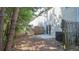 Backyard with a small patio, privacy fence and mature trees offering plenty of shade at 3165 Creston Park Ct, Duluth, GA 30096