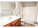 A bathroom featuring a shower-tub combo, sink, and a large mirror at 3165 Creston Park Ct, Duluth, GA 30096