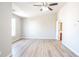 A bedroom with vinyl flooring, ceiling fan, and natural light at 3165 Creston Park Ct, Duluth, GA 30096