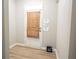 Inviting entryway featuring wood-look flooring, white trim, and a door with window and wooden blinds at 3165 Creston Park Ct, Duluth, GA 30096