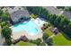 Aerial view of the neighborhood pool, playground and clubhouse with ample parking at 3165 Creston Park Ct, Duluth, GA 30096