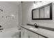 Bathroom features tiled floors, a bathtub, tiled walls, and a vanity sink at 4208 Sierra Creek Ct, Hoschton, GA 30548