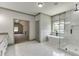 Elegant bathroom with a freestanding tub, glass-enclosed shower, and modern fixtures at 4208 Sierra Creek Ct, Hoschton, GA 30548