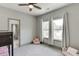 Bedroom showcasing a bunk bed, plush seating, and bright windows creating a comfortable living space at 4208 Sierra Creek Ct, Hoschton, GA 30548
