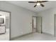 This bedroom features neutral paint, ceiling fan, carpet, and ensuite bathroom and walk-in closet at 4208 Sierra Creek Ct, Hoschton, GA 30548
