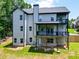 This home features a spacious backyard and a multi-level deck with backyard access at 4208 Sierra Creek Ct, Hoschton, GA 30548