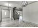 Spacious living area with stairs and hardwood floors at 4208 Sierra Creek Ct, Hoschton, GA 30548