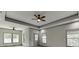 Spacious main bedroom featuring neutral paint, carpet, trey ceiling, recessed lighting, and natural light at 4208 Sierra Creek Ct, Hoschton, GA 30548