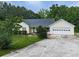 Inviting home exterior with a well-maintained lawn and attached garage, providing comfort at 10307 E Cherokee Dr, Canton, GA 30115