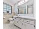 Bathroom featuring tile floor and a white sink vanity with drawers, as well as blinds on the window at 10381 E Cherokee Dr, Canton, GA 30115
