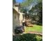 Inviting backyard featuring a wooden deck, lush greenery, and beautiful flowering bushes for outdoor enjoyment at 160 Eastlake Nw Pt, Kennesaw, GA 30144