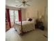 Cozy bedroom featuring a four-poster bed, neutral carpeting, and large windows for a comfortable, relaxing space at 160 Eastlake Nw Pt, Kennesaw, GA 30144