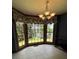 Dining area with large windows offering scenic views and a chandelier at 160 Eastlake Nw Pt, Kennesaw, GA 30144