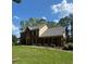 Charming two-story brick home with a well-maintained lawn and mature trees offering curb appeal at 160 Eastlake Nw Pt, Kennesaw, GA 30144