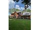 Charming two-story brick home with a well-manicured lawn and mature trees at 160 Eastlake Nw Pt, Kennesaw, GA 30144