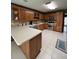 Fully equipped kitchen features stainless steel appliances, wooden cabinets and a tile floor at 160 Eastlake Nw Pt, Kennesaw, GA 30144