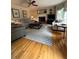 Bright living room featuring hardwood floors, fireplace, and comfortable seating at 160 Eastlake Nw Pt, Kennesaw, GA 30144