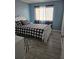 Relaxing bedroom features light blue walls, a white bed frame, and coordinated decor at 22 Fairview Dr, Jonesboro, GA 30238