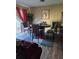 Dining area with a round table, comfortable chairs, hardwood floors, and sliding glass doors at 22 Fairview Dr, Jonesboro, GA 30238