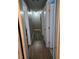 Long hallway with wood flooring, multiple doors, and recessed lighting, provides access to various rooms at 22 Fairview Dr, Jonesboro, GA 30238