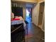 Efficient kitchen featuring black refrigerator, dining area with a table covered with patterned tablecloth at 22 Fairview Dr, Jonesboro, GA 30238
