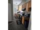 Efficient kitchen featuring wood cabinets, laminate countertops, and modern appliances at 22 Fairview Dr, Jonesboro, GA 30238