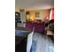 Open-concept living room and dining area with hardwood floors and comfortable seating at 22 Fairview Dr, Jonesboro, GA 30238