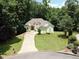 Aerial shot of a home surrounded by mature trees, offering privacy at 235 Pirkle Ct, Cumming, GA 30040