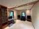 Bedroom with natural lighting from large windows, built in shelves, and wall to wall carpet at 235 Pirkle Ct, Cumming, GA 30040
