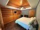 Unique bedroom featuring wooden ceiling, built-in shelves, and hardwood floors at 235 Pirkle Ct, Cumming, GA 30040