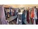 Spacious walk-in closet with ample hanging space and wire rack shelving for optimal storage and organization at 235 Pirkle Ct, Cumming, GA 30040