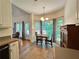 Cozy dining nook with large windows providing abundant natural light and serene backyard views at 235 Pirkle Ct, Cumming, GA 30040