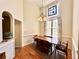 Bright dining room with a stained glass window, wood table, and wood floors at 235 Pirkle Ct, Cumming, GA 30040