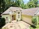 Exterior of a home featuring an attached garage and well-maintained landscaping at 235 Pirkle Ct, Cumming, GA 30040
