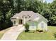 Lovely single-Gathering home featuring a lush lawn and inviting curb appeal at 235 Pirkle Ct, Cumming, GA 30040