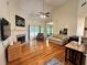 Bright living room with fireplace, hardwood floors, high ceilings, and lots of natural light at 235 Pirkle Ct, Cumming, GA 30040
