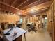 Unfinished basement, featuring exposed wood and visible fixtures, offers renovation potential at 235 Pirkle Ct, Cumming, GA 30040