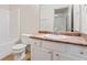 Bathroom featuring white cabinetry, stone countertops, and a combination tub and toilet at 2714 Haynescrest Dr, Grayson, GA 30017