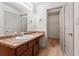Bathroom featuring a single sink with stone countertops, and a walk-in closet at 2714 Haynescrest Dr, Grayson, GA 30017