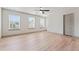 Spacious bedroom with three windows, a ceiling fan, and wood-look flooring at 2714 Haynescrest Dr, Grayson, GA 30017