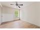 Bedroom with wood-look floors, ceiling fan, and a window at 2714 Haynescrest Dr, Grayson, GA 30017