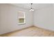 Bright dining room with hardwood floors, large windows, and a modern light fixture at 2714 Haynescrest Dr, Grayson, GA 30017