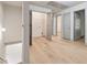 Hallway with wood floors and several doorways, including an open closet at 2714 Haynescrest Dr, Grayson, GA 30017