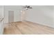 View of the spacious living room showcasing wood floors, neutral walls, and a doorway at 2714 Haynescrest Dr, Grayson, GA 30017