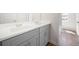 Bathroom features double sinks, gray cabinets, and modern fixtures at 2975 Jefferson St, Austell, GA 30106