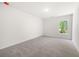 Spacious bedroom with neutral carpet and large window at 2975 Jefferson St, Austell, GA 30106